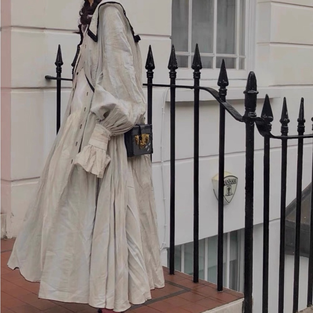 Designer navy collar shirt long dress coat with statement detail design.